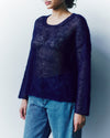 person wearing a knitted mohair jumper
