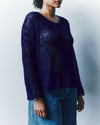 person wearing a knitted mohair jumper