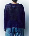 person wearing a knitted mohair jumper