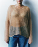 model wearing a light brown knitted jumper