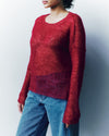 person wearing a red mohair knitted jumper