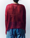 person wearing a red mohair knitted jumper