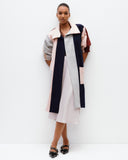 Model wears Spliced Felt Coat in contrast colours
