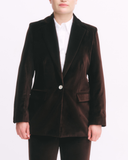 Brown velvet blazer worn by a person on a white background