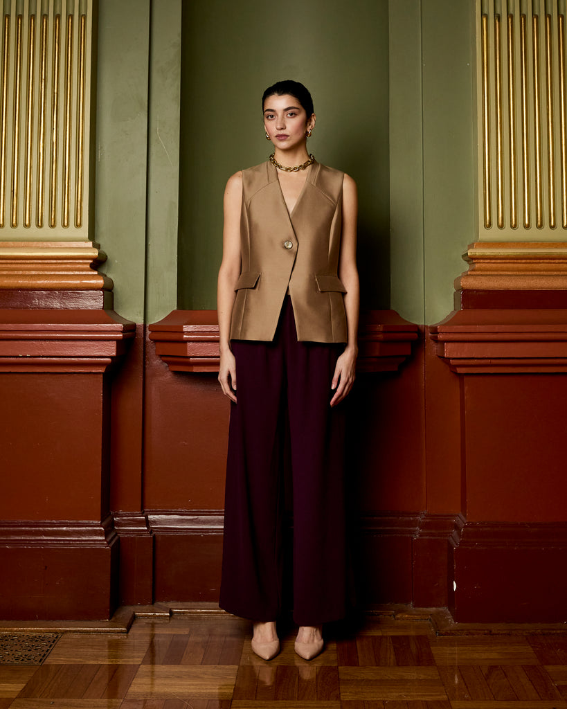 Model wears Asymmetric Vest in Burnt Sugar