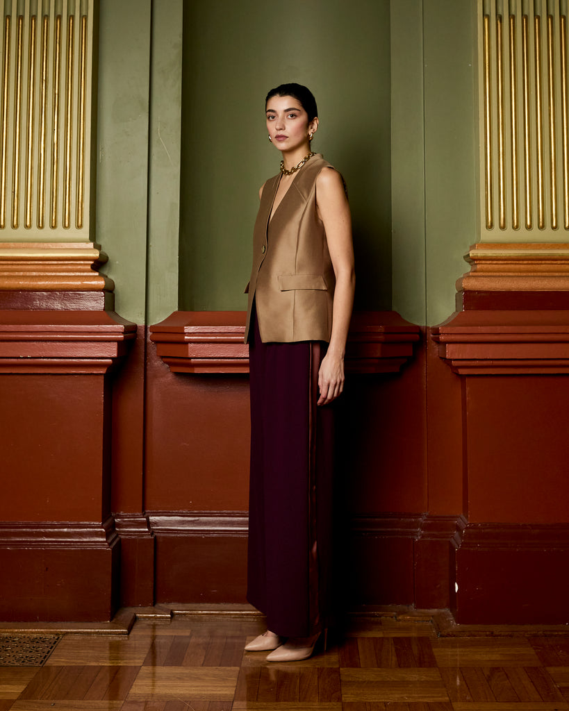 Model wears Asymmetric Vest in Burnt Sugar