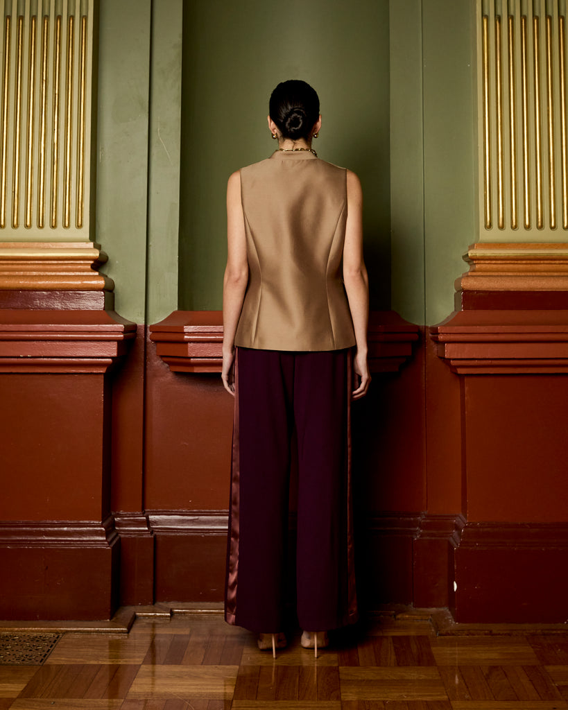 Model wears Asymmetric Vest in Burnt Sugar