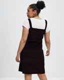 Model wears Aubergine Corduroy Pinafore 