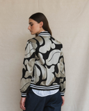 Model wearing silver and black aviator