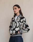 Model wearing silver and black aviator