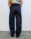 denim barrel leg pants on a model