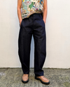 denim barrel leg pants on a model
