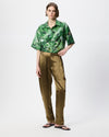 Model wearing chartreuse coloured satin barrel leg pants 