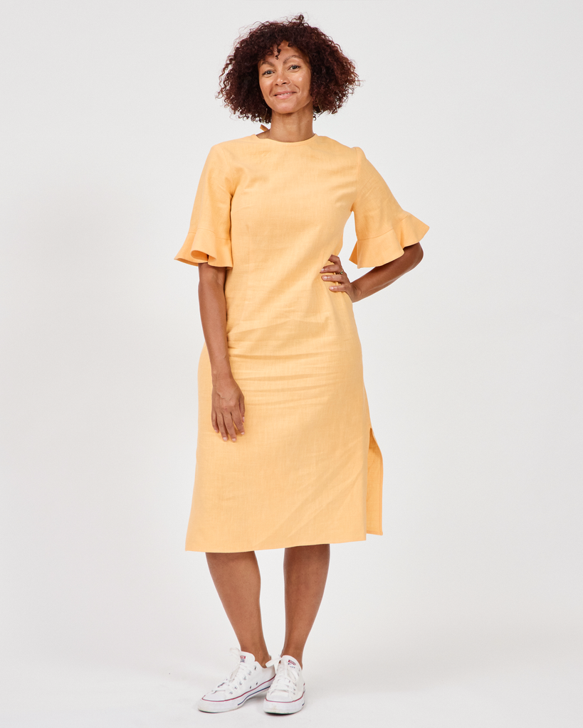 Model wears Billy Linen Dress in butterscotch