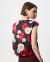 Model wearing a burgundy floral print satin silk top.