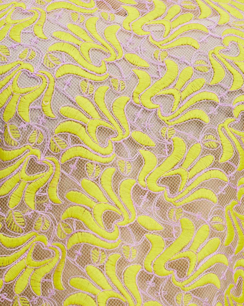 Close up of Canary Charm Sports Raglan Lace Fabric