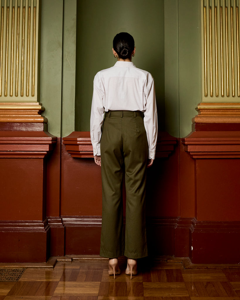 Model wears Dark Olive Pinstripe Pant
