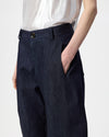 model wearing denim barrel leg pants, up close