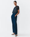 Model wears Navy Dolman top with silver speckles throughout the fabric