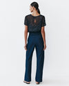 Model wears Navy Dolman top with silver speckles throughout the fabric