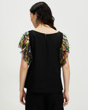 Model wears Ember Spark Sequin Sleeve Top