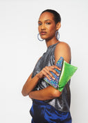 Model hold Fariba's Triangles Foldover Purse (Green Velvet)