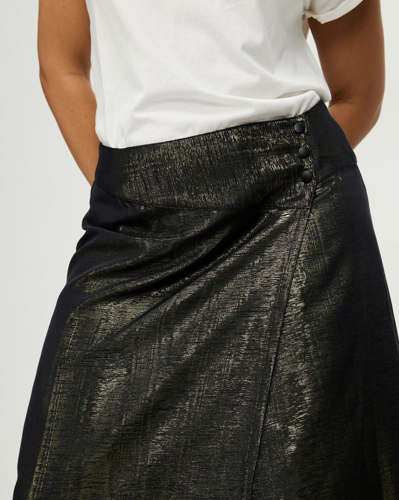 Model wears Golden Hour Asymmetric Wrap Skirt