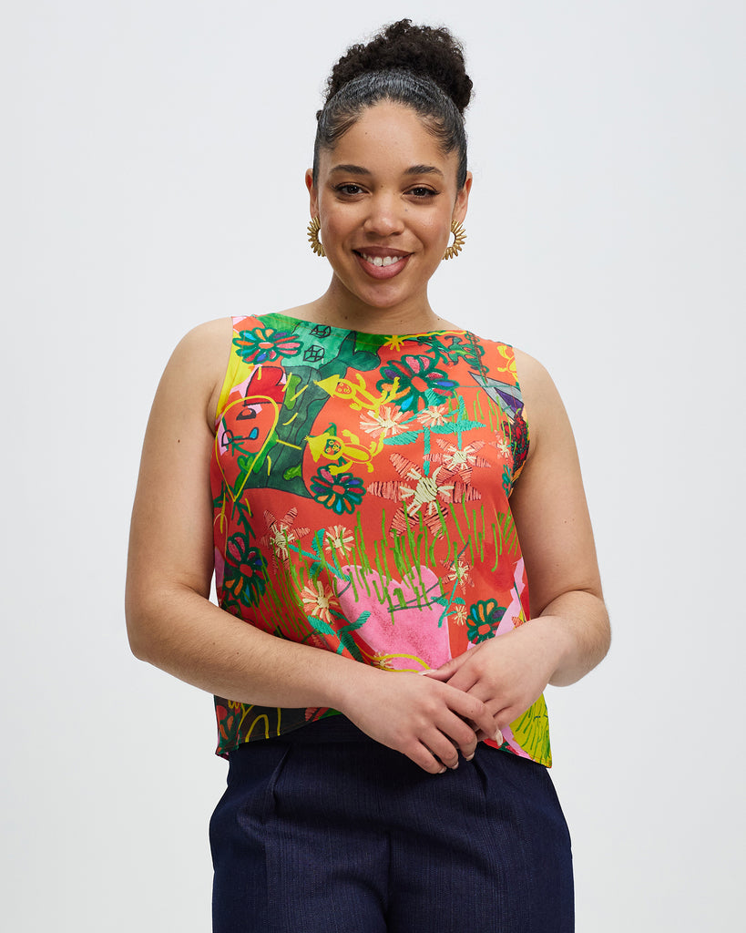 Model wears Community Print Granville Heroes silk Shell Top