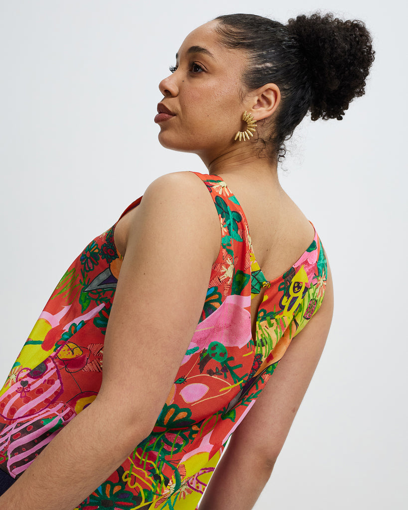 Model wears Community Print Granville Heroes silk Shell Top