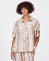 Model wears Kai relaxed shirt in Peach