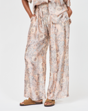 Model wears Kai relaxed pants in peach