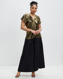 Model wears Liquid Gold Karen Top