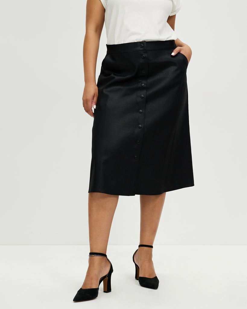 Model wears Liquorice Wax Denim A-line Skirt