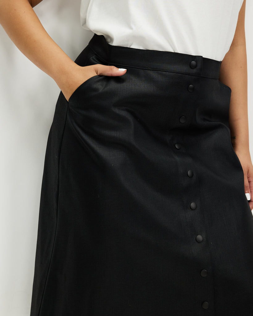 Model wears Liquorice Wax Denim A-line Skirt