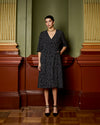 Model wears Navy Spot Wrap Dress