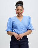 Model wears Periwinkle Crush Linen Wrap Top