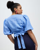 Model wears Periwinkle Crush Linen Wrap Top
