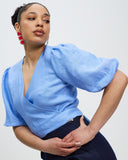 Model wears Periwinkle Crush Linen Wrap Top