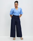 Model wears Periwinkle Crush Linen Wrap Top