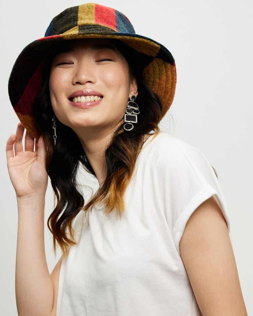Model wears Plaid Patchwork Bucket Hat