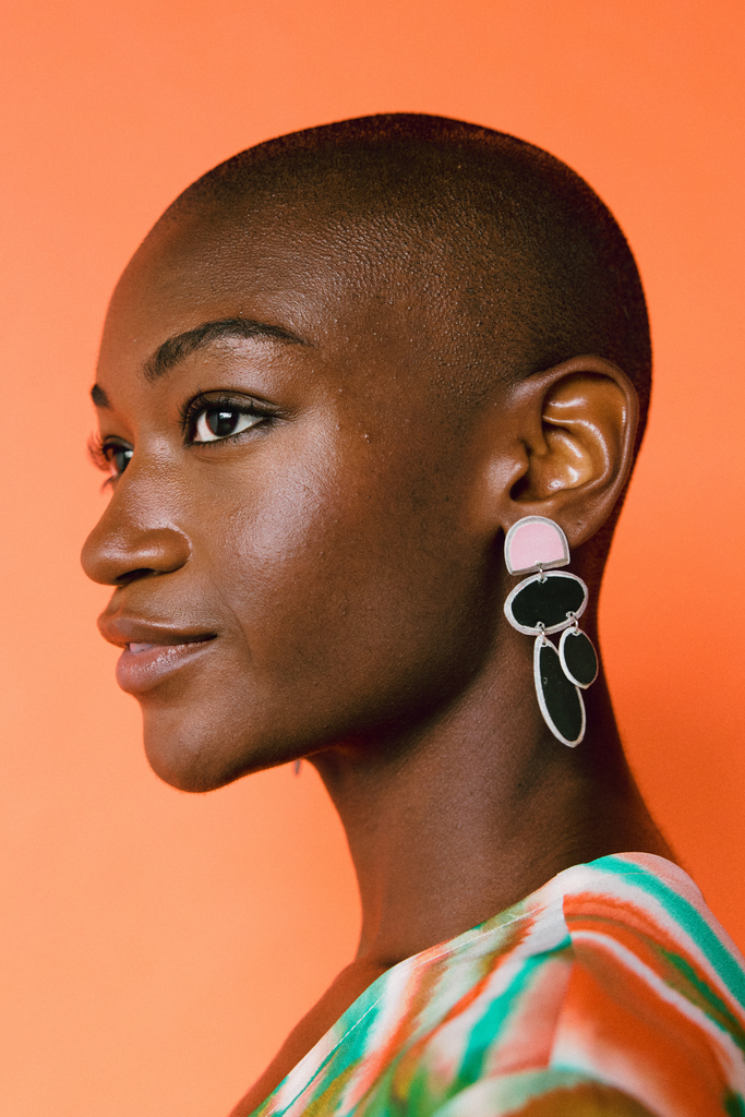 Model wears Quazi Design Bonga Pink/Black Earrings