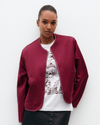 Model wears Quilted Liner Silk Jacket in Cherry Red