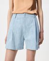 model wearing pale blue elemental denim shorts