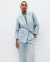 Model wears The Social Outfit Suit Blazer in Elemental Denim.
