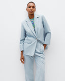 Model wears The Social Outfit Suit Blazer in Elemental Denim.