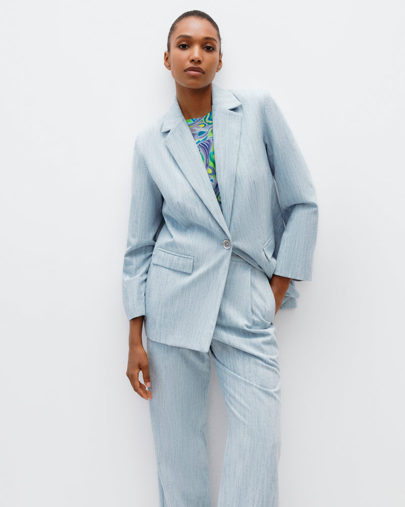 Model wears The Social Outfit Suit Blazer in Elemental Denim.