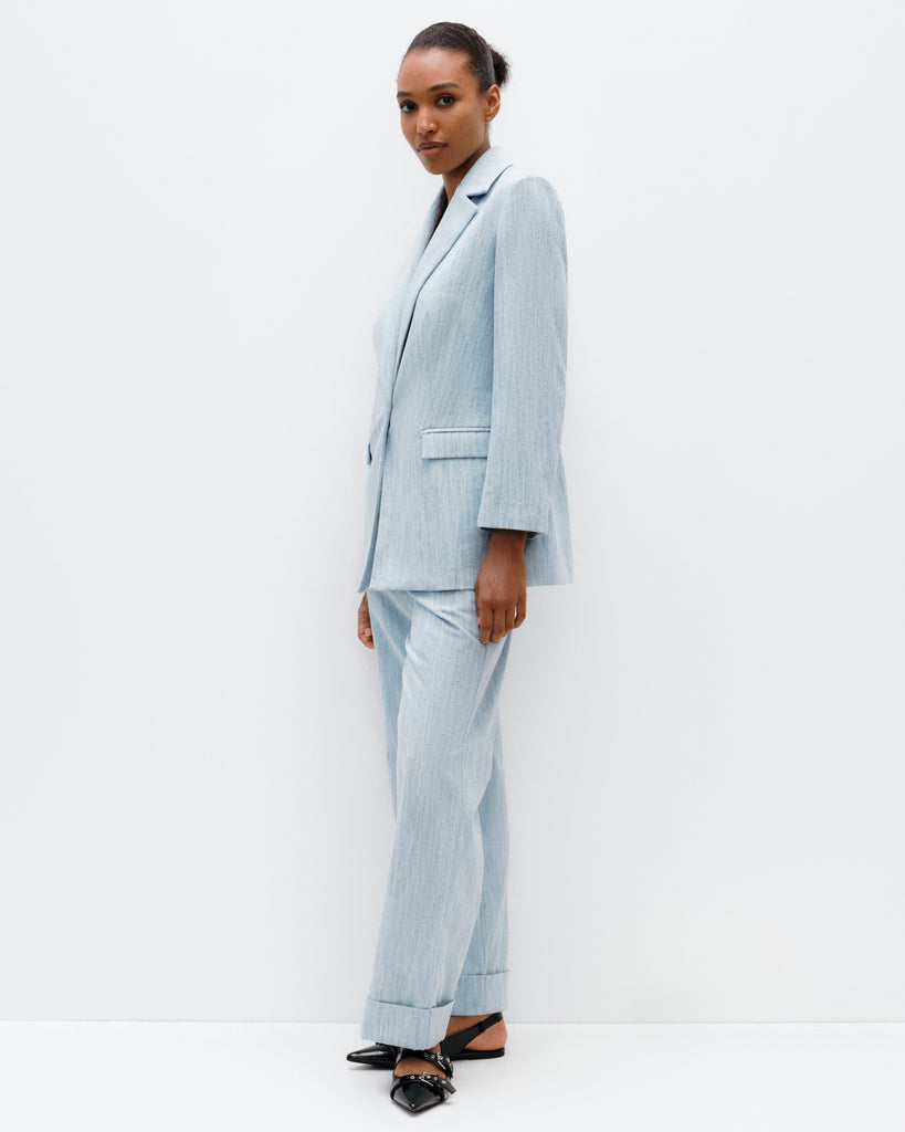 Model wears The Social Outfit Suit Blazer in Elemental Denim.