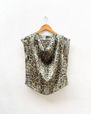 Leopard print sleeveless top on a hanger against a white background