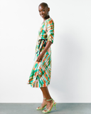 Model wears Tropical Fern Wrap Dress