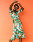 Model wears Tropical Fern Wrap Dress